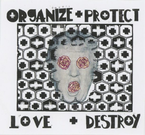 Grey shirts with white text "organize + protect" with the face of a hypnotized Donald Trump and text below "love + destroy". Screen printed, union made.